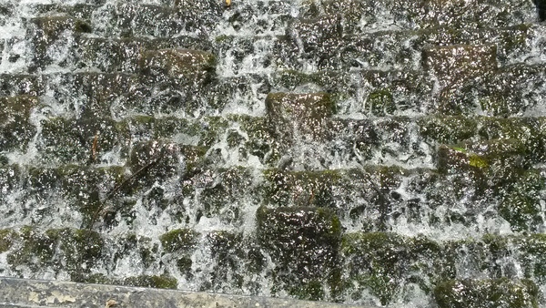 Water falling down the steps.